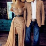 Mannequins dressed in western formal wear featuring a gold gown and a tan blazer with jeans.
